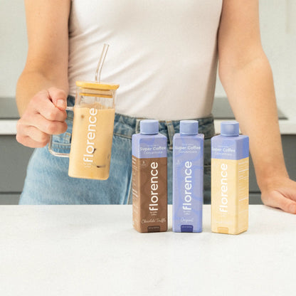 A trio of coffee concentrate flavors pictured with a glass tumbler.